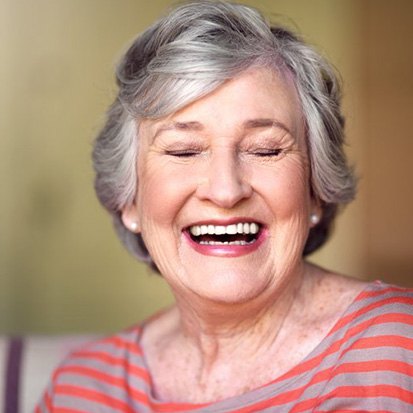 Woman smiling in the comfort of her own home