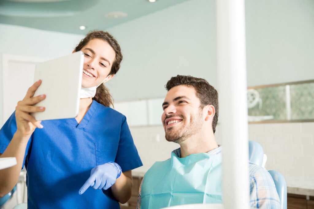 Dentist explains something to patient